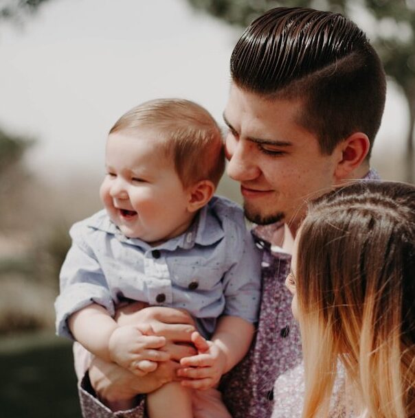 Couple holding an infant