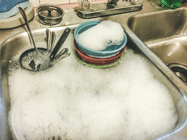 Sink full of dirty dishes