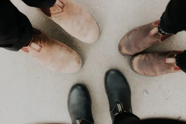 Three pairs of feet from a bird's eye view